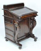 A reproduction mahogany davenport, the lid opening to reveal eight fitted drawers,