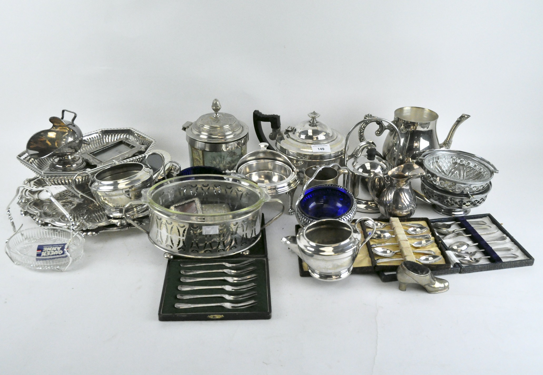 A large sellection of silver plate, to include a teapot and cover, mirror frame, two trays, bowls,