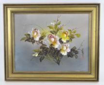 A contemporary oil on board depicting a floral still life, indistinctly signed,