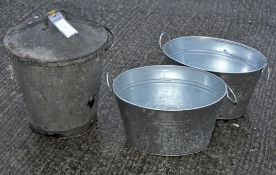 A fire bucket with metal basket to the inside, handle to the lid and to the bucket,