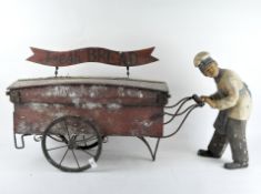 A novelty wooden 'Fresh Bread' advertising wagon, modelled as a baker pushing a cart,