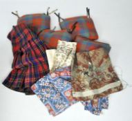 A mixed box of textiles and tartan, including a kilt,