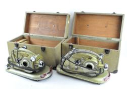 A 1960's Gem Pathescope projector, with the original cables, together with a similar example,