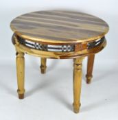 A contemporary round wooden table, with pierced metalware frieze, on turned baluster legs,