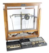 Set of Griffin & Tatlock Ltd weighing scales with three sets of cased weights, early 20th century,