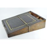 A mahogany and brass bound writing slope with fitted interior and black leather inset,