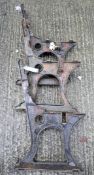 Pierced cast iron bench ends and a middle, remains of black paint,