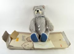 A Steiff baby blue bear, 2007, with certificate numbered EAN 037085 and box,