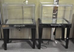 Two jewellery display cabinets, each glazed to the front with mirrored base, with frieze drawer,