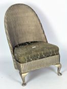 A vintage Lloyd Loom style chair with upholstered seat,