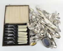 A selection of silver plated flatware, comprising knives, forks, spoons and more