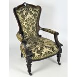 A 19th Century carved mahogany arm chair with wood framed back,