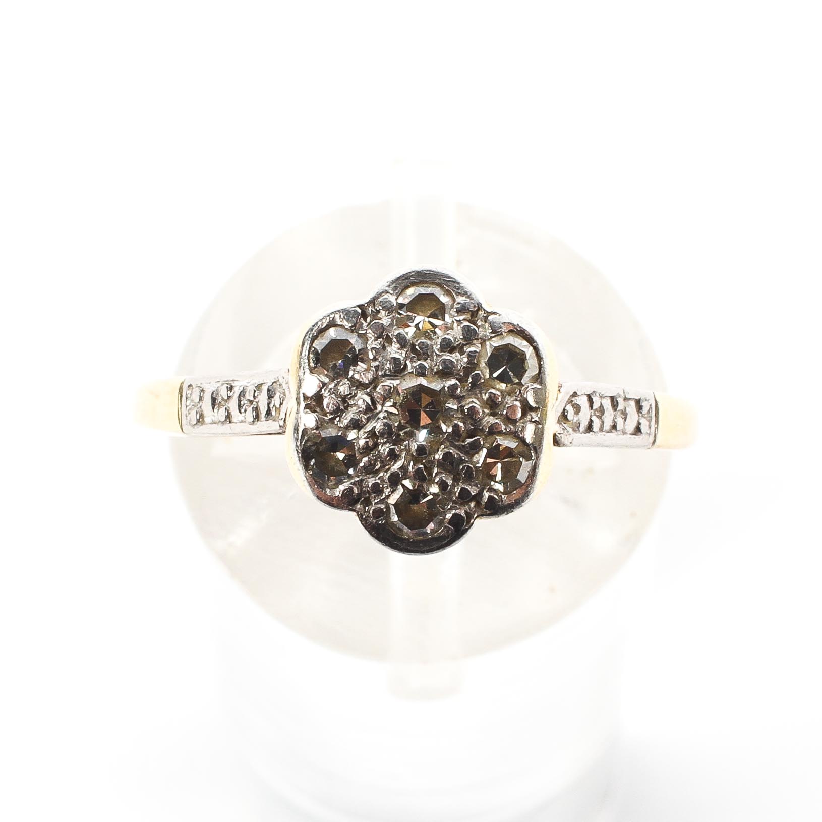 An 18ct gold and platinum flower ring. Set with seven single cut diamonds. 2.1g. Size M. - Image 2 of 4