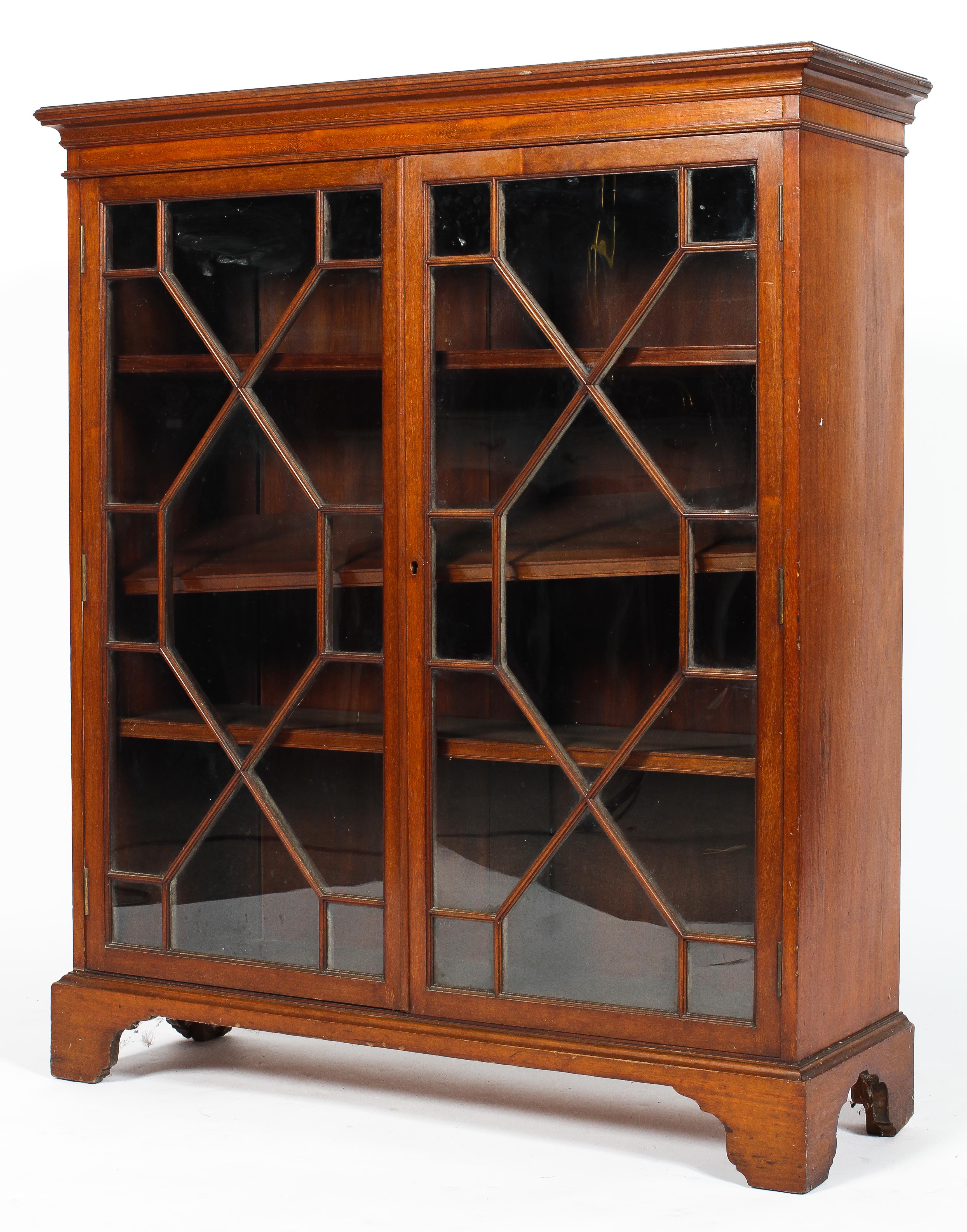 A Victorian mahogany bookcase, two doors with fitted and glazed glass panels, on raised feet,