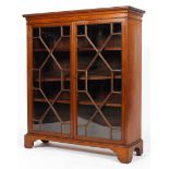 A Victorian mahogany bookcase, two doors with fitted and glazed glass panels, on raised feet,