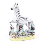 A Staffordshire pottery model of a zebra, circa 1870,