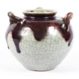 A Chinese style stoneware flambe three-handled oviform jar, 19th century,