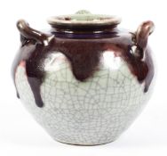 A Chinese style stoneware flambe three-handled oviform jar, 19th century,