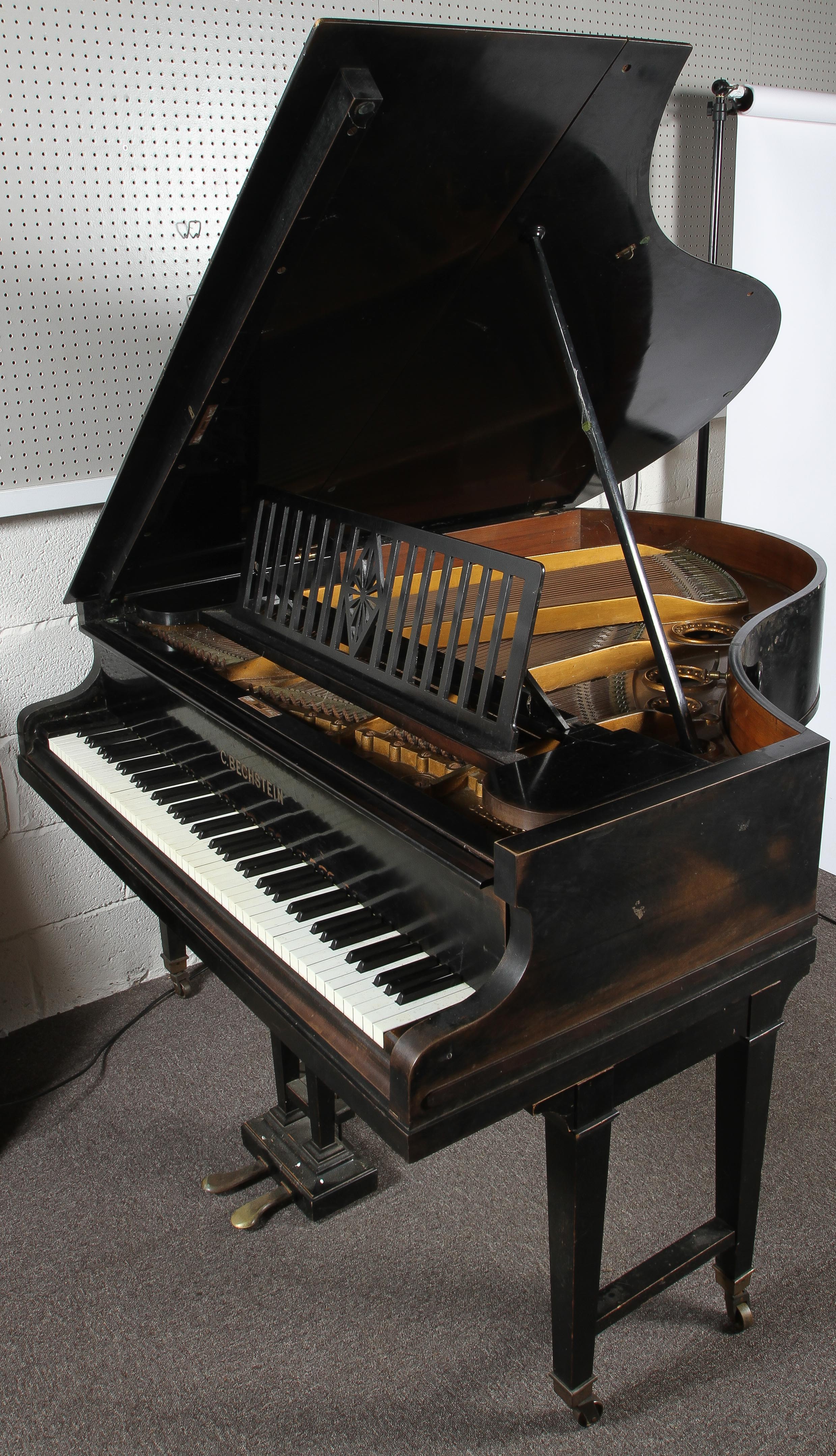 A vintage C. Bechstein baby grand piano, on wheels, in ebonised case, approximately 162cm long.