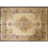 An Oriental style wool rug, cream ground with central geometric medallion,