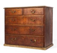 A Georgian oak chest of drawers, with two short drawers above three graduated drawers,