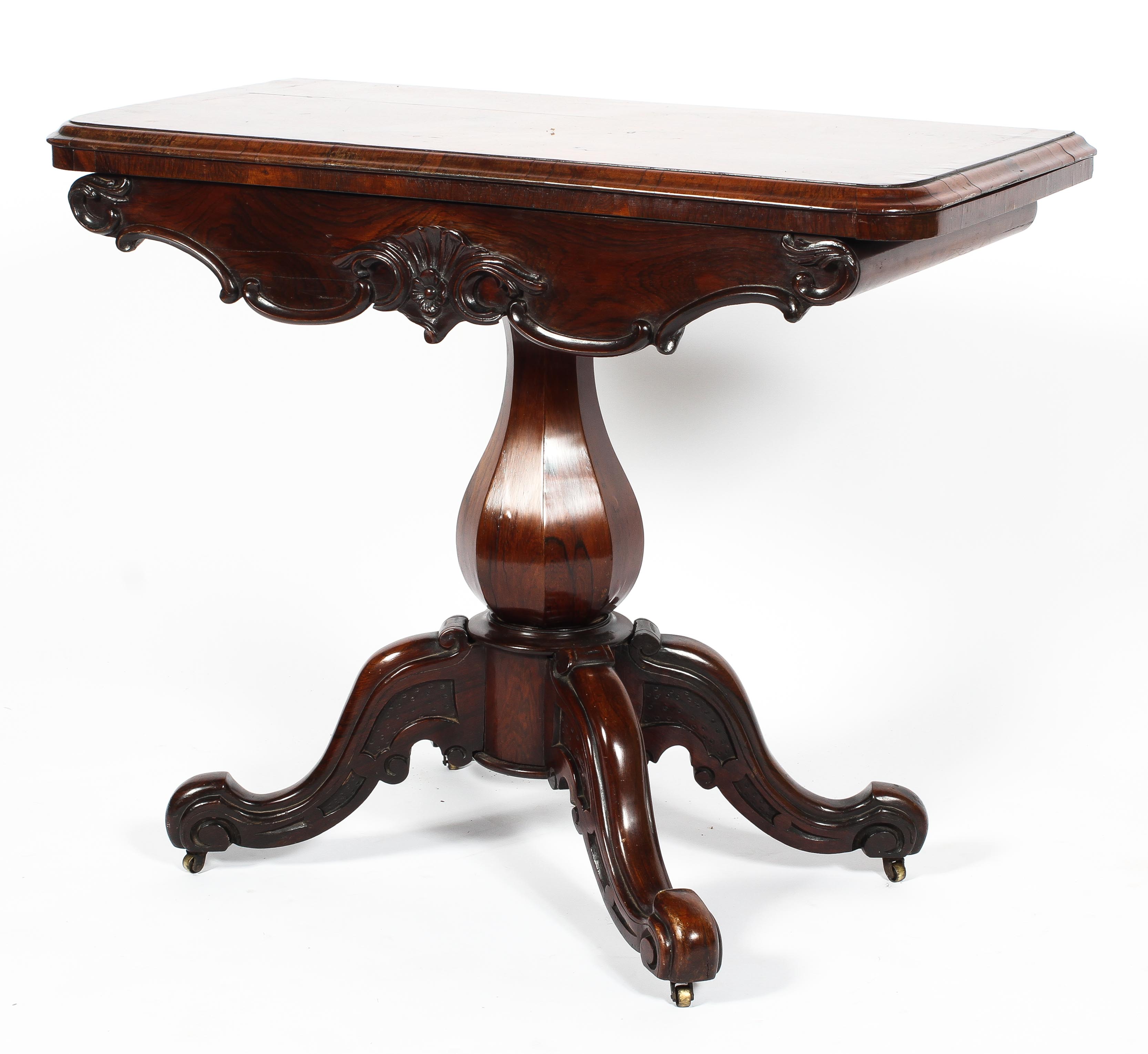 A Victorian carved rosewood card table, the moulded folding top inset with circular green baize, - Image 2 of 2