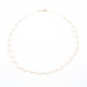 A 14ct gold and seed pearl necklace. 3.7g gross. .