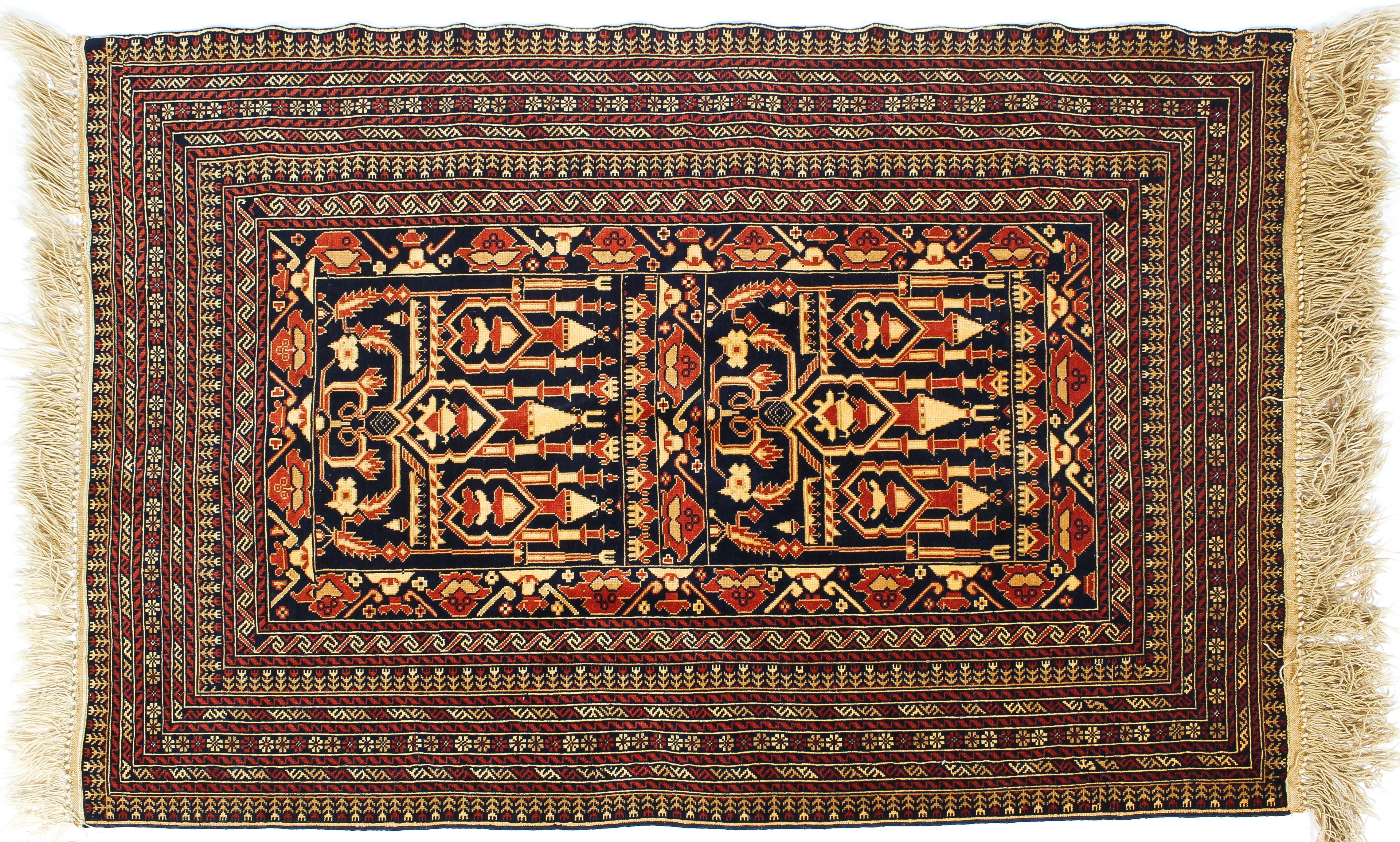A Persian style wool rug red and cream ground with central geometric panel and geometric borders,