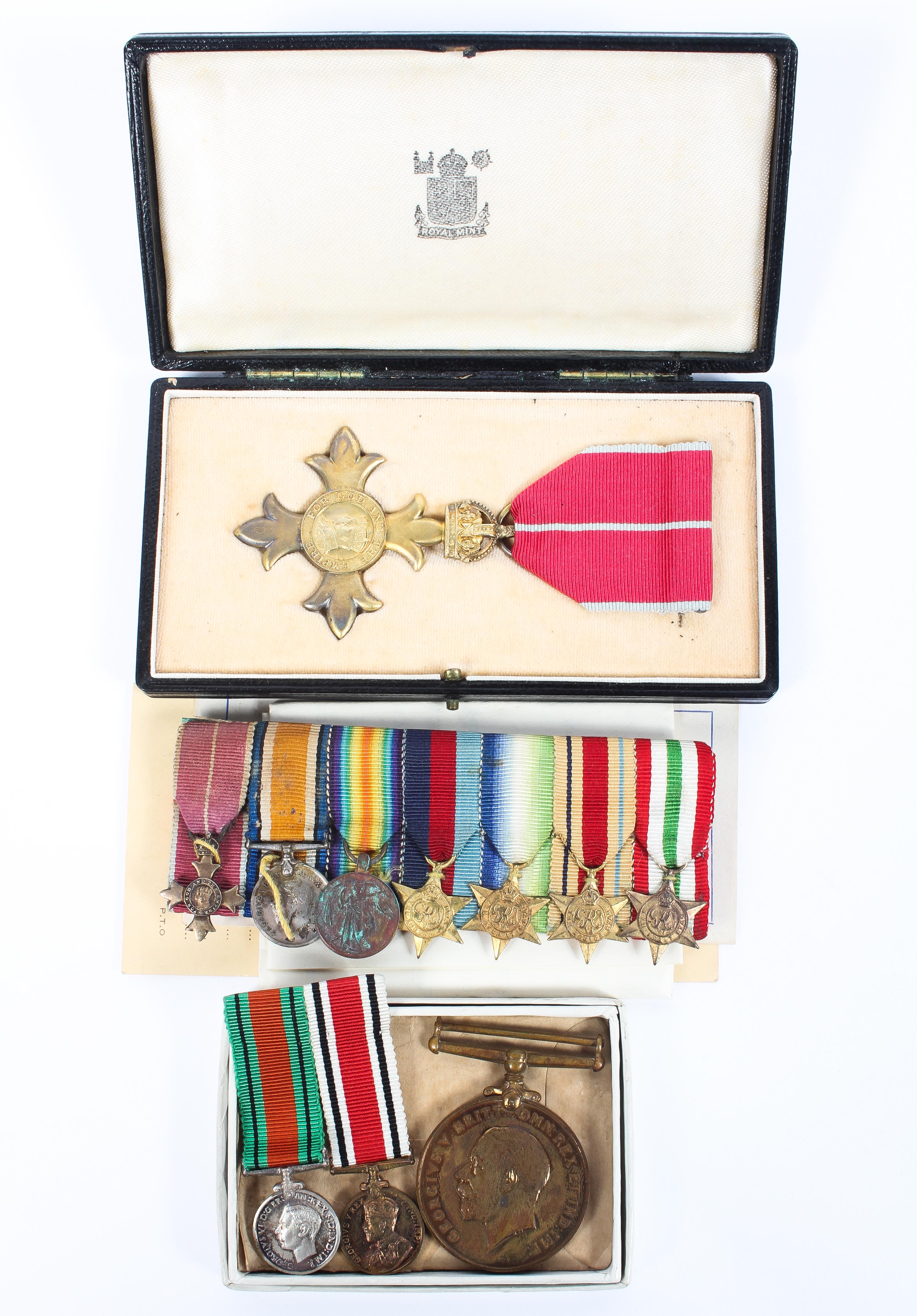 A Boxed OBE medal together with corresponding collection of seven dress medals