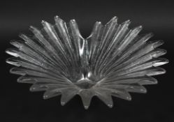 A Dartington crystal bowl, formed as a radiating shell shape, with label, 33.5 cm wide.