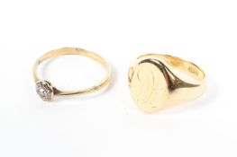 An 18ct gold gentleman's signet ring together with an unmarked yellow metal paste set ring. 8.1g.