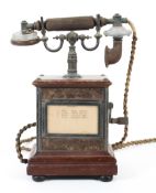 An early 20th century wind up phone, the mouthpiece stamped no.