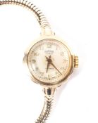 A lady's 9ct gold wristwatch by Roamer, the dial with Arabic numerals denoting hours,