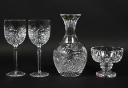 A Waterford Crystal decanter and two wine glasses, cut with diamonds and hobnail pattern,