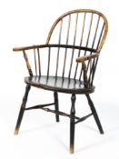 A Liberty & Co Arts and Crafts ebonised Windsor armchair,