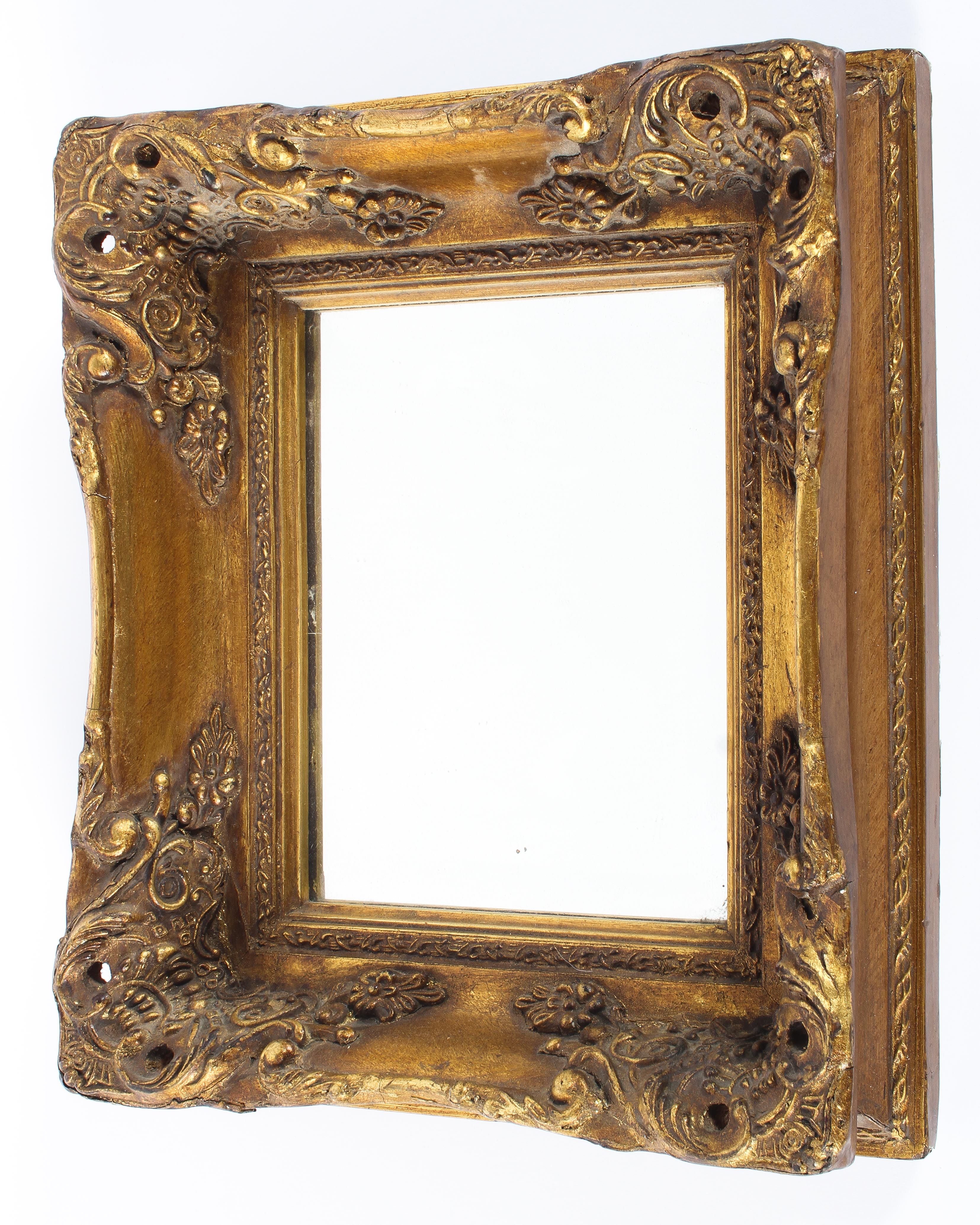A giltwood and gesso bevelled rectangular mirror, late 19th/early 20th century,