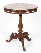 An Italianate inlaid wine table with pierced gallery and carved tripod base. 69cm x 56cm.