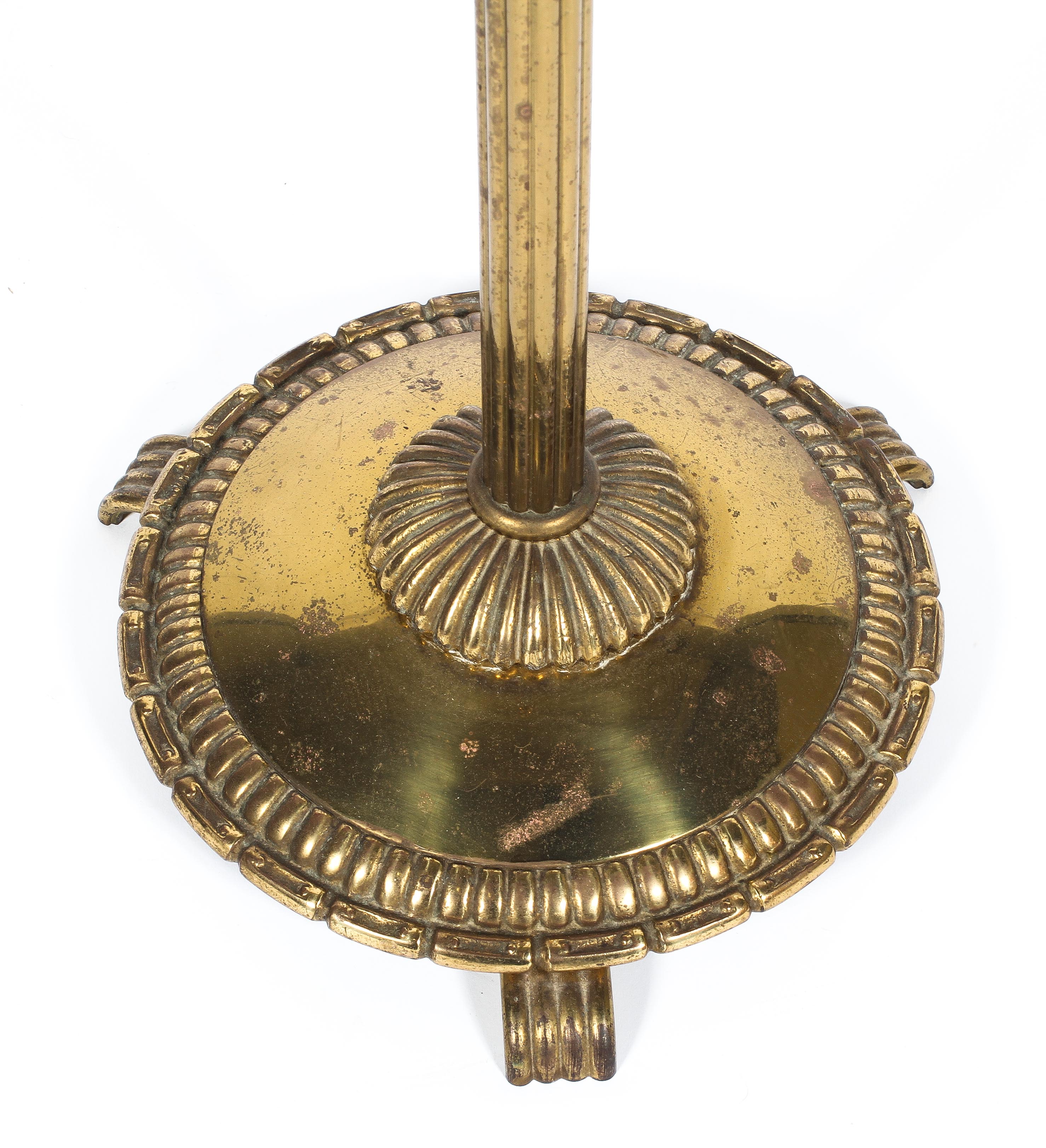 A brass standard lamp, 20th century, with reeded column on gadrooned circular base with scroll feet, - Image 2 of 2