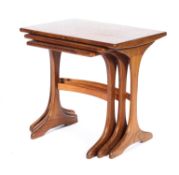 A nest of three G-plan teak tables, of rectangular form, with spreading supports,