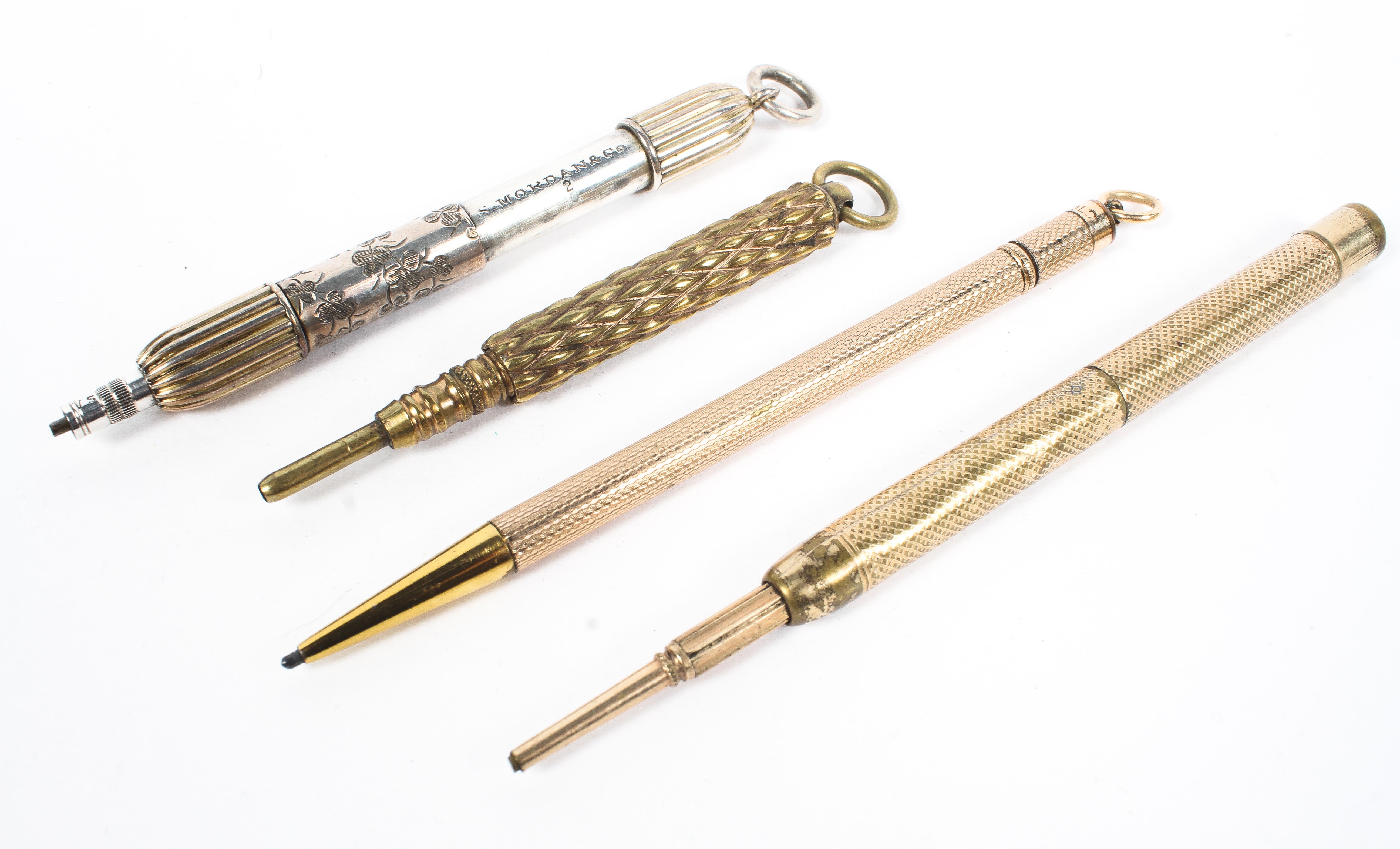 Four yellow and white metal propelling pencils, two with engine turned decoration to the handles, - Image 4 of 4
