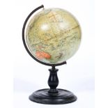 A vintage Phillips 9 inch terrestrial globe, early 20th century, bearing label to top,