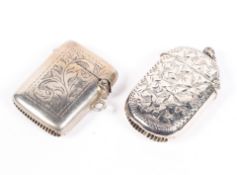 Two early 20th century silver vesta cases, both with chased decorations,