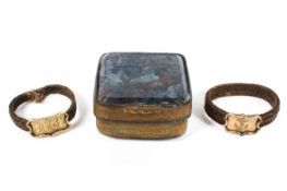 Two yellow metal and woven hair memorial or love token rings,