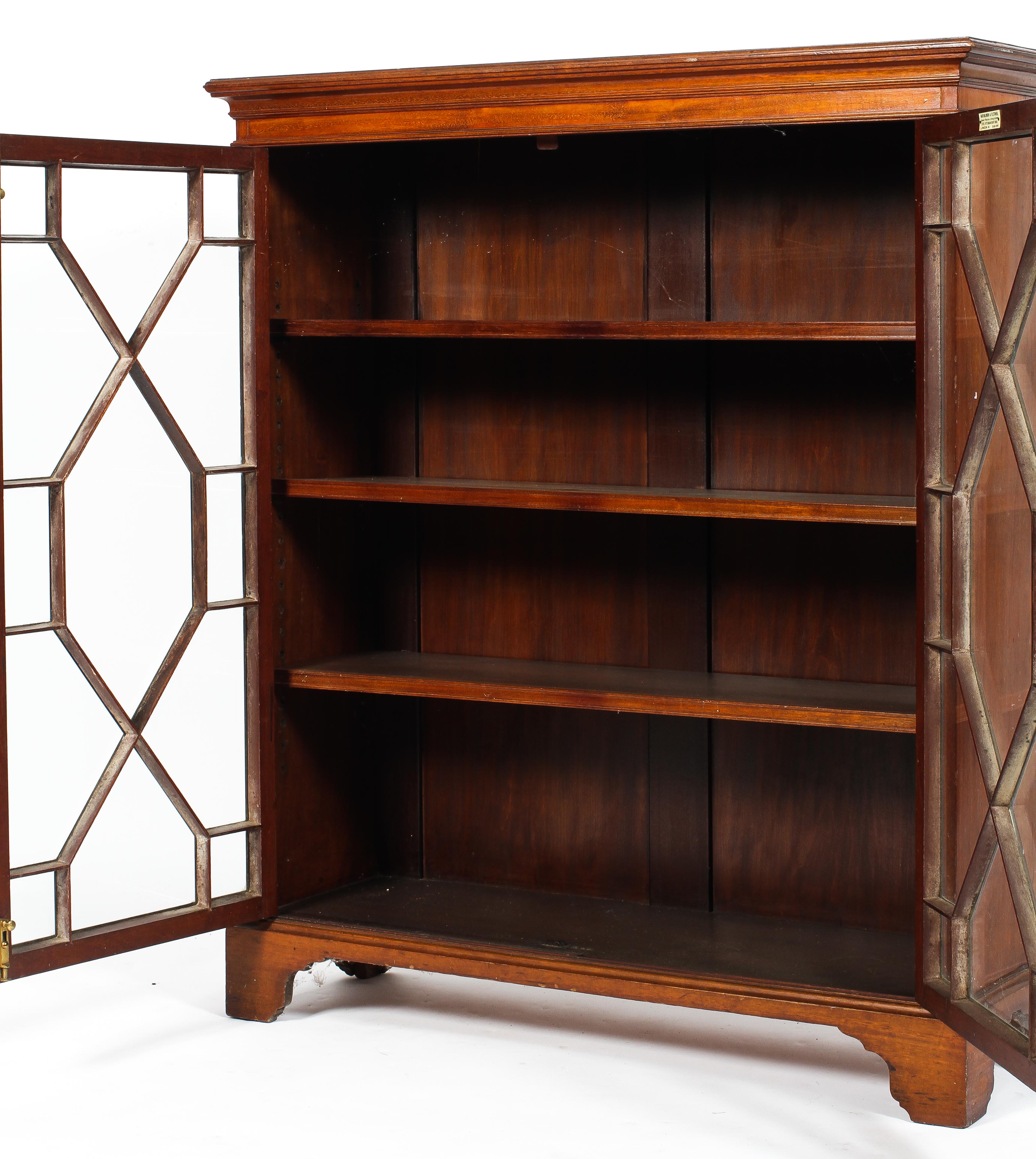 A Victorian mahogany bookcase, two doors with fitted and glazed glass panels, on raised feet, - Image 2 of 2