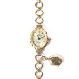 A 9ct gold ladies wristwatch by Sovereign, case and strap marked 9ct,