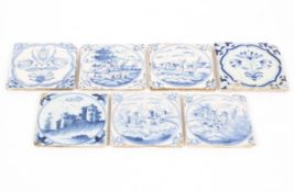 A collection of seven 18th Century and later Dutch Delft blue and white tiles,