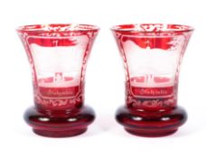 A pair of German Biedermeier engraved topographical ruby glass beakers, mid-19th century,