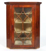 A Sheraton style mahogany and stringing inlaid corner cabinet, with astragal glazing,