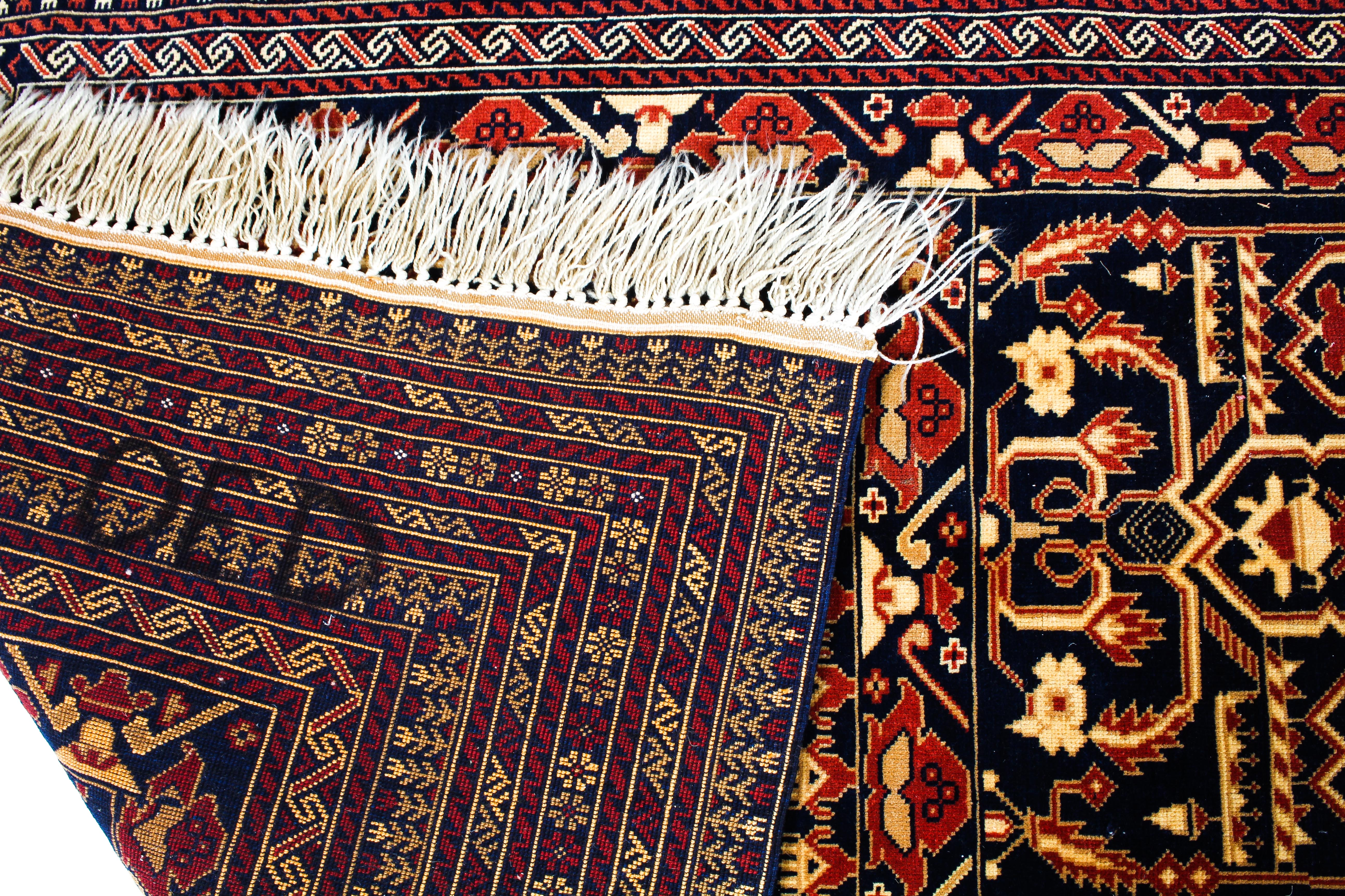 A Persian style wool rug red and cream ground with central geometric panel and geometric borders, - Image 3 of 3