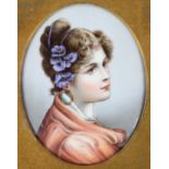 A Continental porcelain oval portrait plaque of a young lady, late 19th century, in glazed frame,